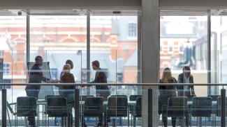 people-shaking-hands-in-a-boardroom